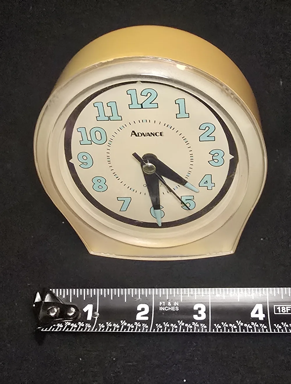 Advance Yellow Clock with Aqua Numerals